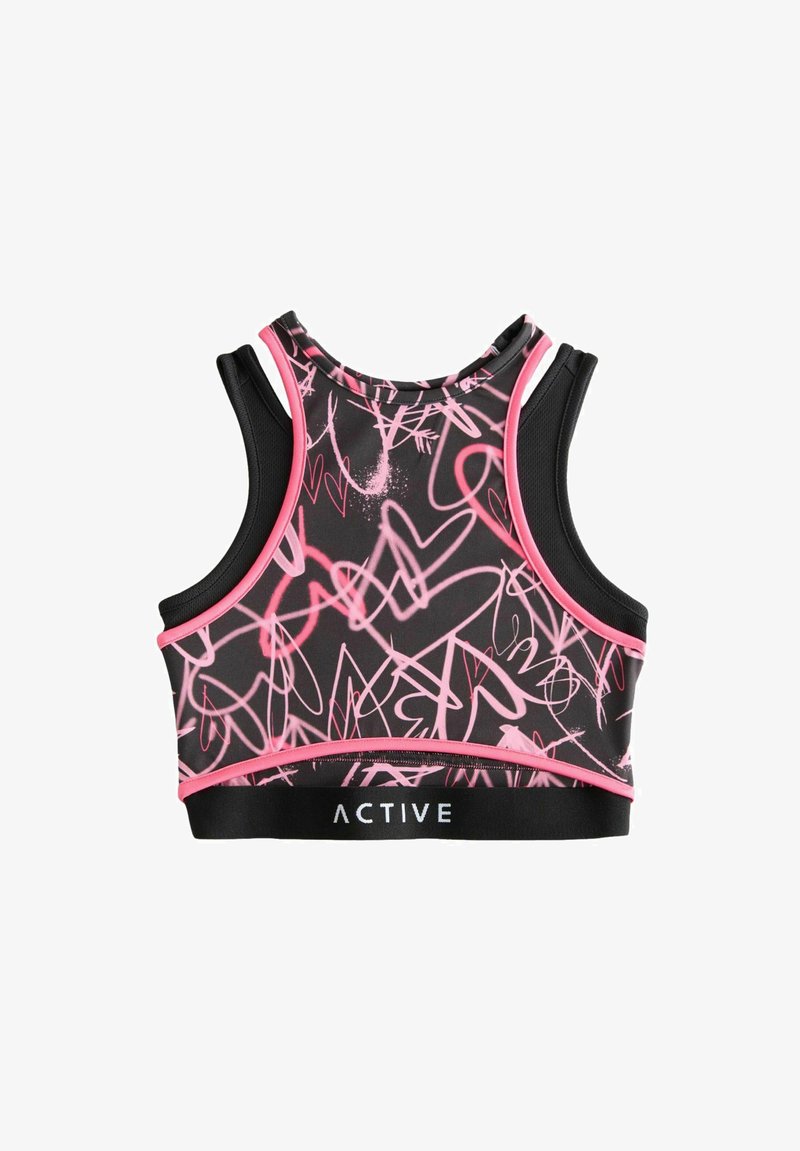 Brassière de sport activewear noire avec motifs de cœurs roses, présentant une coupe ajustée, des accents en maille et une bande élastique de marque en bas.
