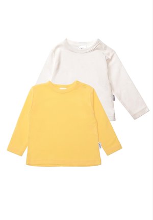 Two long-sleeve t-shirts: one creamy white with a round neckline and shoulder snaps, the other bright yellow with a smooth texture.