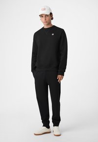 Fila BIELLA REGULAR - Verryttelyhousut - black