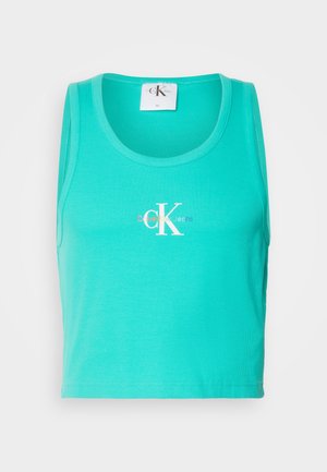 Turquoise ribbed tank top with a round neckline, featuring a white "CK" logo. Material is soft and stretchy, cut in a cropped style.