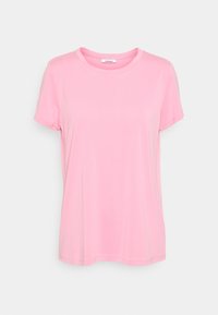 T-shirt rose pâle à manches courtes et col rond, coupe décontractée, présenté sur un fond gris clair.