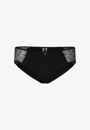 Slip bikini nero con parte anteriore liscia e pannelli laterali in pizzo con un motivo geometrico, accentuato da un piccolo ciondolo in metallo in vita.