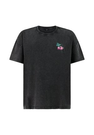 Black oversized short-sleeve t-shirt with small graphic of green clover, pink hand, and pink text "PROTECT" on left chest.