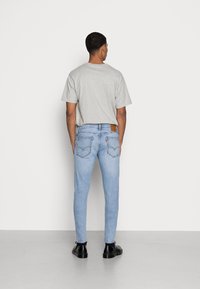 Levi's® SKINNY TAPER - Calças de ganga de corte skinny - up town