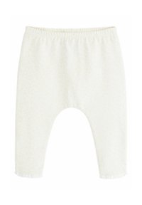 Collants blancs avec un motif floral subtil, tissu doux, taille élastique et ourlet froncé. Ajustement décontracté et ample au niveau des jambes.