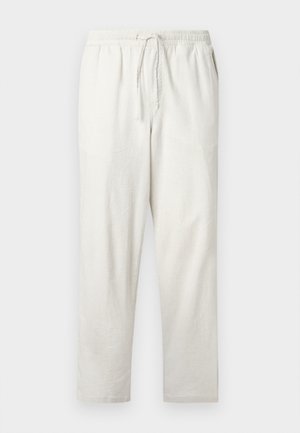 Lys beige linbukse med elastisk midjebånd og justerbar snor. Rett snitt med glatt tekstur og uten mønstre.