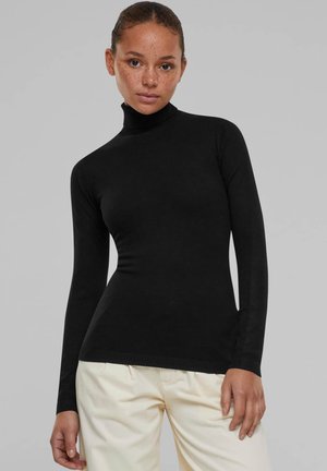 Black turtleneck sweater made of stretchy material, featuring long sleeves and a fitted design with ribbed accents at the collar and hem.