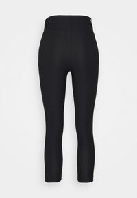 Leggings noirs avec une taille haute, une texture lisse et une coupe ajustée. Dotés d'une poche à l'arrière. Conviennent pour un usage décontracté.
