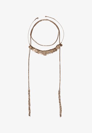 Collier délicat en chaîne en or rose avec de petits pendentifs ronds et deux longs pompons suspendus à chaque extrémité.