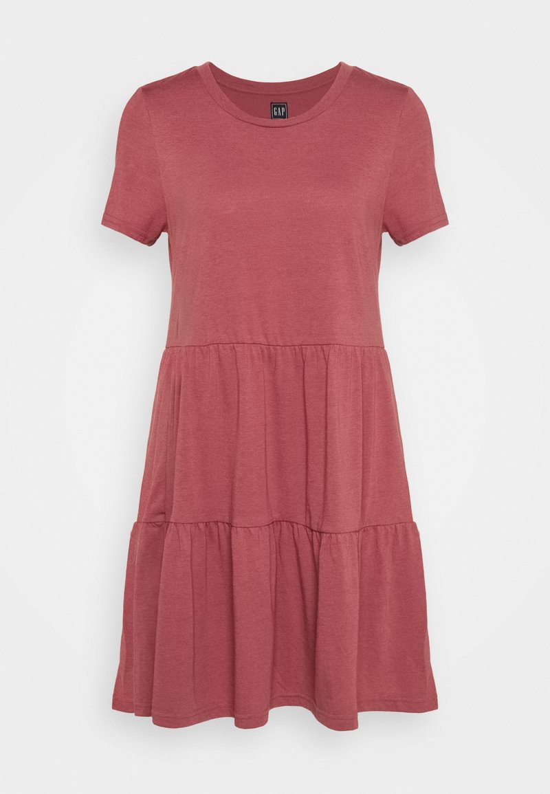 Robe à manches courtes, longueur genoux, en rose pâle, fabriquée en tissu doux. Dotée d'un col rond et d'un design en étages avec une texture froncée.