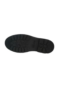 Black rubber shoe sole with textured surface and tread pattern, featuring a durable design and embossed brand name "solidus."