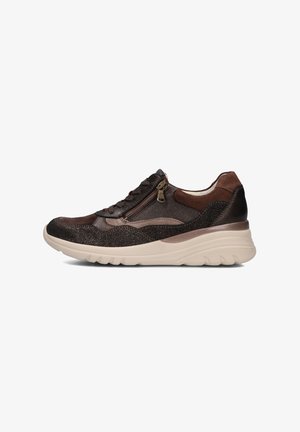 Brown athletic shoe featuring a textured upper, front laces, side zipper, and a cushioned lightweight sole with curved edges.