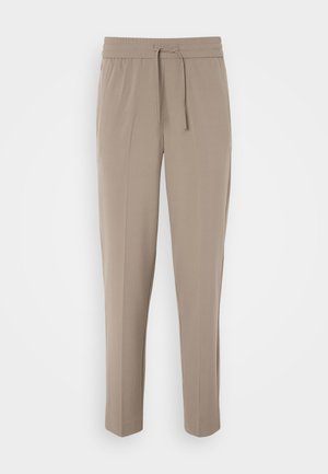 Heledad beezised püksid elastse vöökohtaga, reguleeritava paelaga ja kitsenevad sääred. Kanga pind näib sile ja kerge sära.