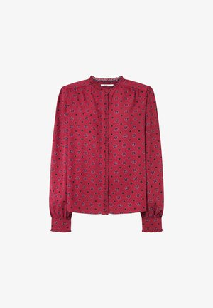 Punainen nappikauluspaita kukkakuosisella, jossa on röyhelökaulus ja kootut pitkät hihat elastisilla hihansuilla. Kevyt kangas.