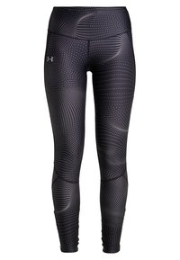 Leggings sportivi neri con un motivo a pois ondulati, vita alta e tessuto elastico, progettati per comfort e libertà di movimento.