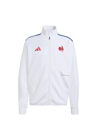 Biała kurtka na suwak z wysokim kołnierzem, niebieskimi paskami na ramionach, czerwonymi akcentami i emblematem koguta na lewej piersi; wykonana z gładkiej tkaniny.