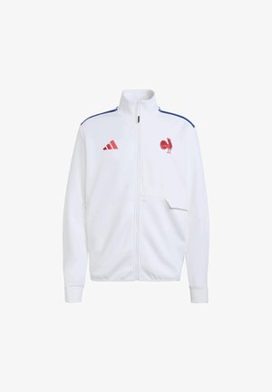 Bijela jakna na patentni zatvarač s visokim ovratnikom, plavim prugama na ramenima, crvenim detaljima i grbom pijetla na lijevoj strani prsa; napravljena od glatkog tkanja.