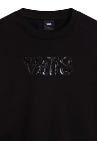 Sweatshirt noir avec un graphique "VANS" texturé et brillant. Col rond côtelé et tissu doux. Design simple et minimaliste.