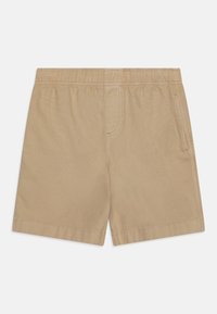 Shorts beiges fabriqués en tissu léger. Dotés d'une taille élastique, d'une poche latérale et de coutures soignées. Coupe droite et texture lisse.