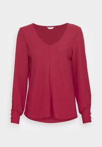 Burgundská halenka s dlouhým rukávem a výstřihem do V, která má na rukávech nařasené detaily a knoflíkové ozdoby na manžetách. Měkká, hladká tkanina s volnějším střihem.