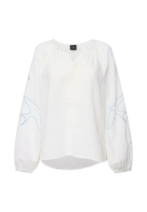 Blusa bianca in lino con maniche lunghe, caratterizzata da ricami di uccelli blu e oro sulle maniche. Design a scollo a V con dettaglio arricciato sul collo.