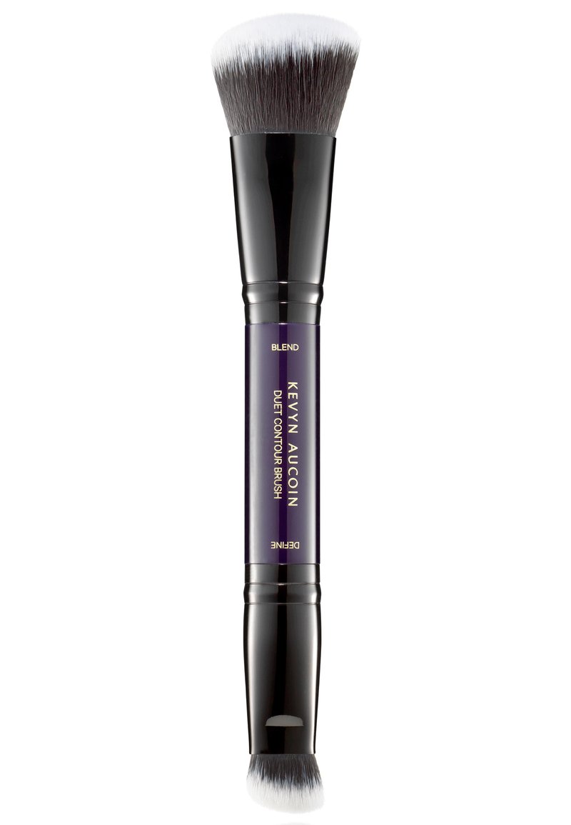 Pinceau de contour à double embout avec des poils blancs denses. Le manche noir est orné d'un accent violet portant les inscriptions "Estomper" et "Définir". Design lisse et élégant.