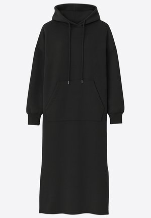 Zwarte hoodiedress gemaakt van zachte stof, met een kangoeroezak, lange mouwen en een ontspannen pasvorm. Eenvoudig ontwerp zonder patronen.