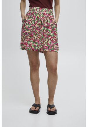 Shorts floreali con elastico in vita, caratterizzati da un mix di colori rosa, verde e crema. Due tasche laterali e una vestibilità rilassata.