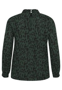Long-sleeve top in dark green fabric with a black abstract pattern, featuring a high neck, keyhole back, and gathered detailing at the neckline.