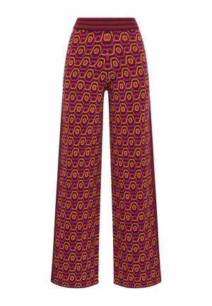 Pantalon à jambes larges en tissu tricoté avec un motif hexagonal en rose, orange et marron. La ceinture est côtelée pour plus de confort.