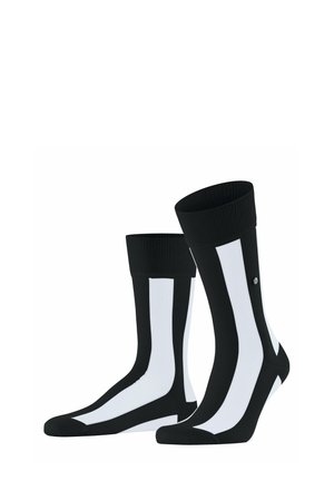 Schwarz-weiße knielange Socken mit vertikalen weißen Streifen auf der Vorderseite und gerippten Bündchen, nebeneinander dargestellt.
