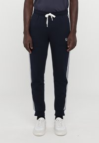 EA7 Emporio Armani PANTALONI - Treniņtērpa apakšdaļas - blue