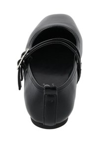 Black leather shoe with a rounded toe, open back design, and a decorative strap. Smooth texture and minimal detailing, mounted on a flat sole.