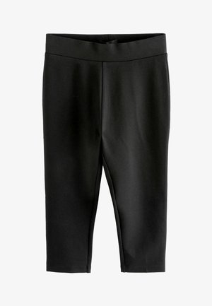 Leggings noirs en tissu lisse, avec une large ceinture et une longueur crop, sans fermetures ni embellissements visibles.