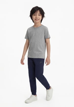 Nike Sportswear UNISEX - Teplákové kalhoty - obsidian/black