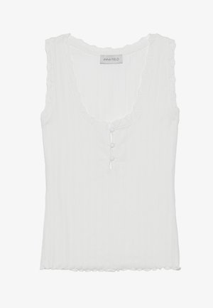 Balts ribots bezpiecējs topiņš ar izsistu kakla izgriezumu un viļņotiem maliņām, kā arī trim pogām priekšā. Mīksta, viegla auduma.