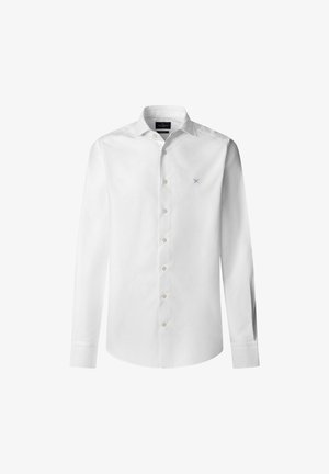 Camicia bianca a maniche lunghe in cotone. Presenta una chiusura frontale a bottoni, colletto classico e un logo blu discreto sul petto. Texture liscia.