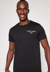 Björn Borg ESSENTIAL - Pamata T-krekls - black beauty