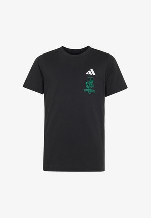 Maglietta nera a maniche corte con logo Adidas bianco e grafica verde pixelata di un personaggio Minecraft sul petto sinistro.