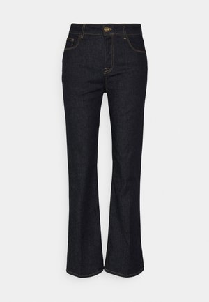Dark blue denim flared jeans with a classic five-pocket design and contrasting yellow stitching. Features a front button closure and belt loops.