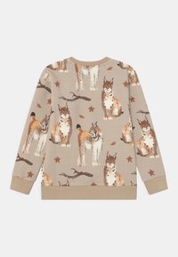 Sudadera beige de manga larga con un patrón repetido de lince y hojas de otoño. Textura suave con dobladillo y puños acanalados.