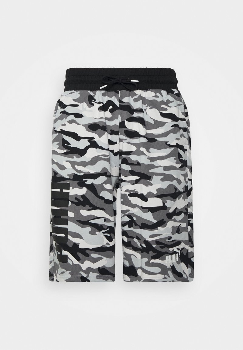 Grå kamouflagebyxor med svart elastisk midjeband och dragsko. Har en logotyp i vitt på nedre högra benet.