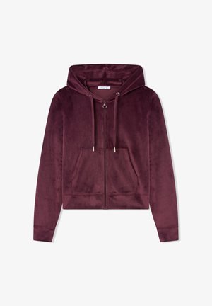 Burgundowa bluza z zamkiem błyskawicznym, wykonana z miękkiego, aksamitnego materiału. Posiada przednią kieszeń, kaptur ze sznurkiem oraz ściągacze na rękawach. Prosty, krótki fason.