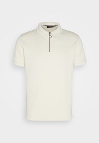 Short-sleeve polo shirt in off-white textured fabric, featuring a collar and a half-zip closure with a circular pull tab.