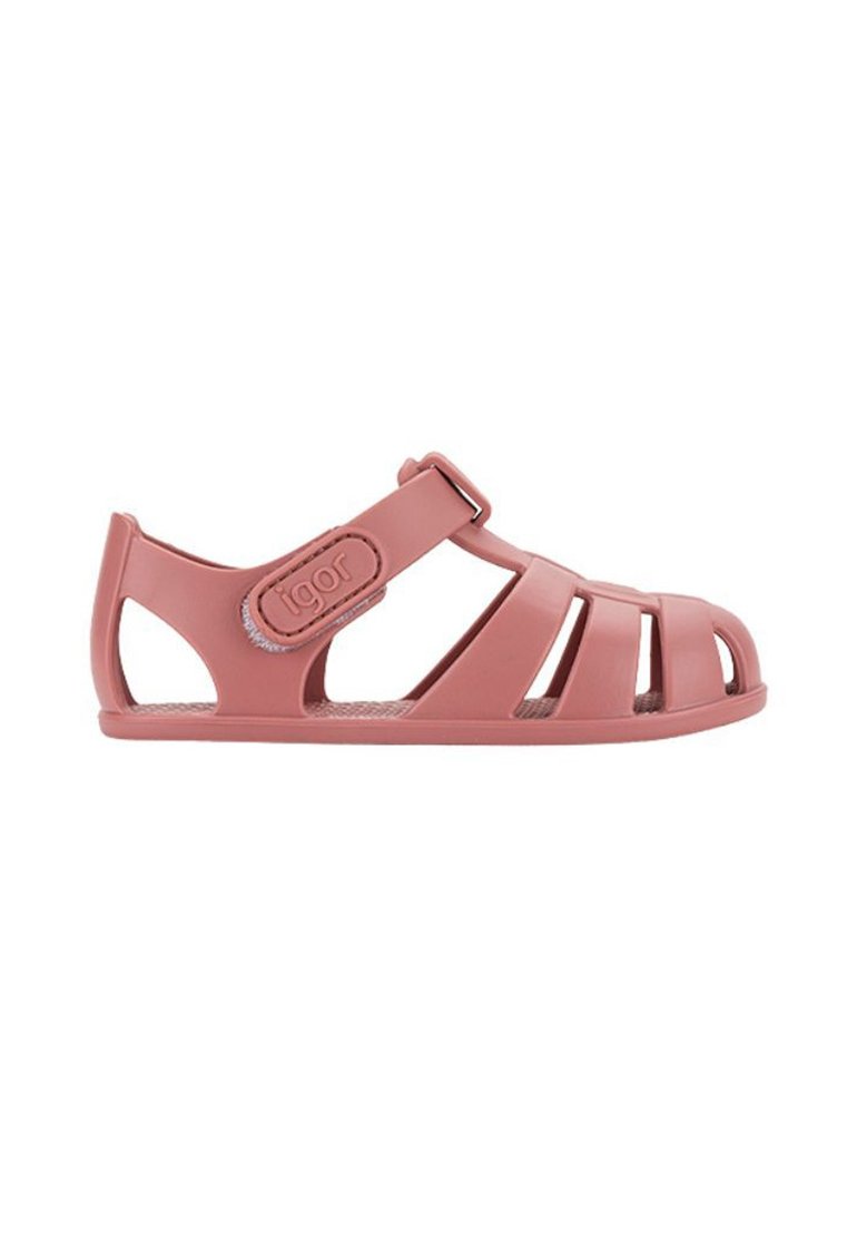 Pink plastic sandal with open design, featuring multiple straps, adjustable buckle, and a textured insole.