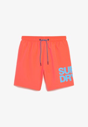Bright neon orange swim shorts with an elastic waistband, blue drawstring, and large "SUPER DRY" graphic in blue on the left leg.