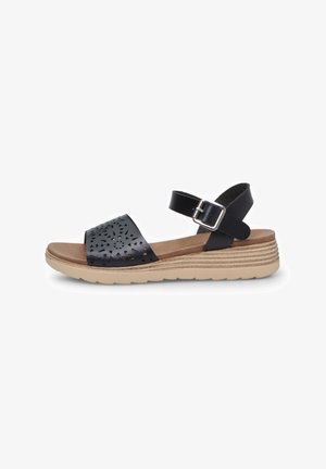 Must black leather sandaal, millede mustri ja reguleeritava pahkluu pandla ning beeži kummist tallaga, millel on horisontaalsed triibud.