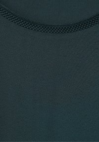 Dark green fabric with a smooth texture, featuring a round neckline accentuated by a textured knit trim. Simple and solid design.