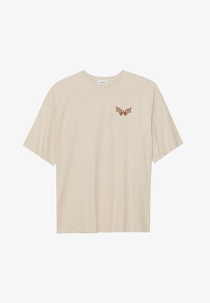 Beige cotton t-shirt with short sleeves, featuring a small brown graphic of wings and the text "SLEEPY CLUB" on the chest.