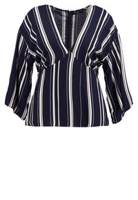 Blusa blu navy con strisce verticali bianche, maniche a palloncino a tre quarti e scollatura a V profonda con zip sul retro.